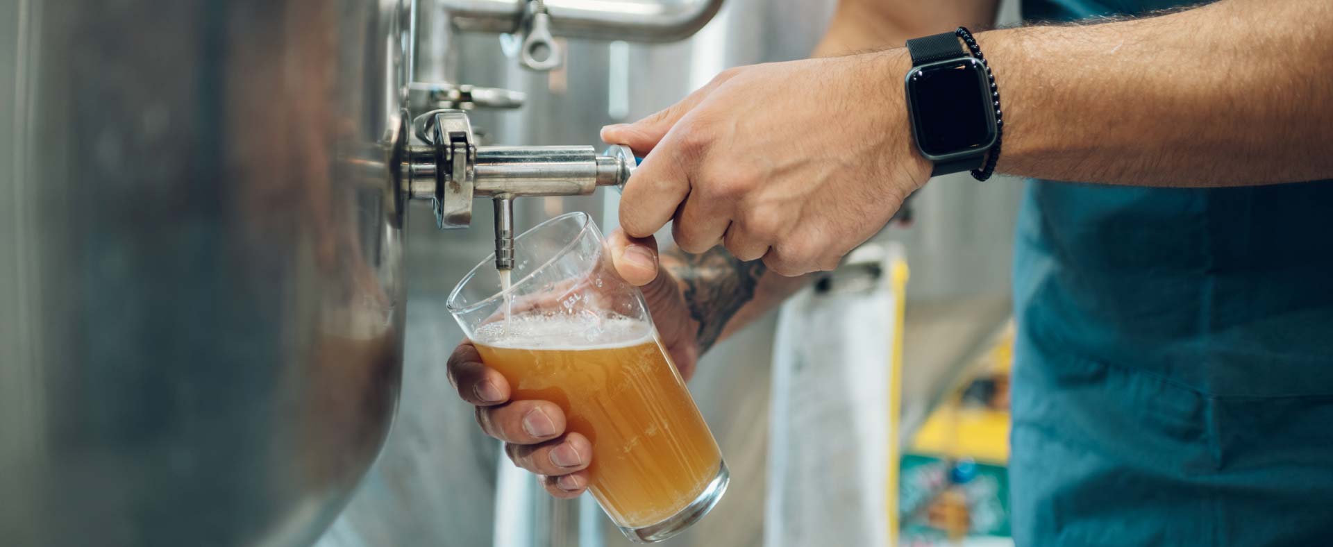 Sampling the beer during the beer brewing process
