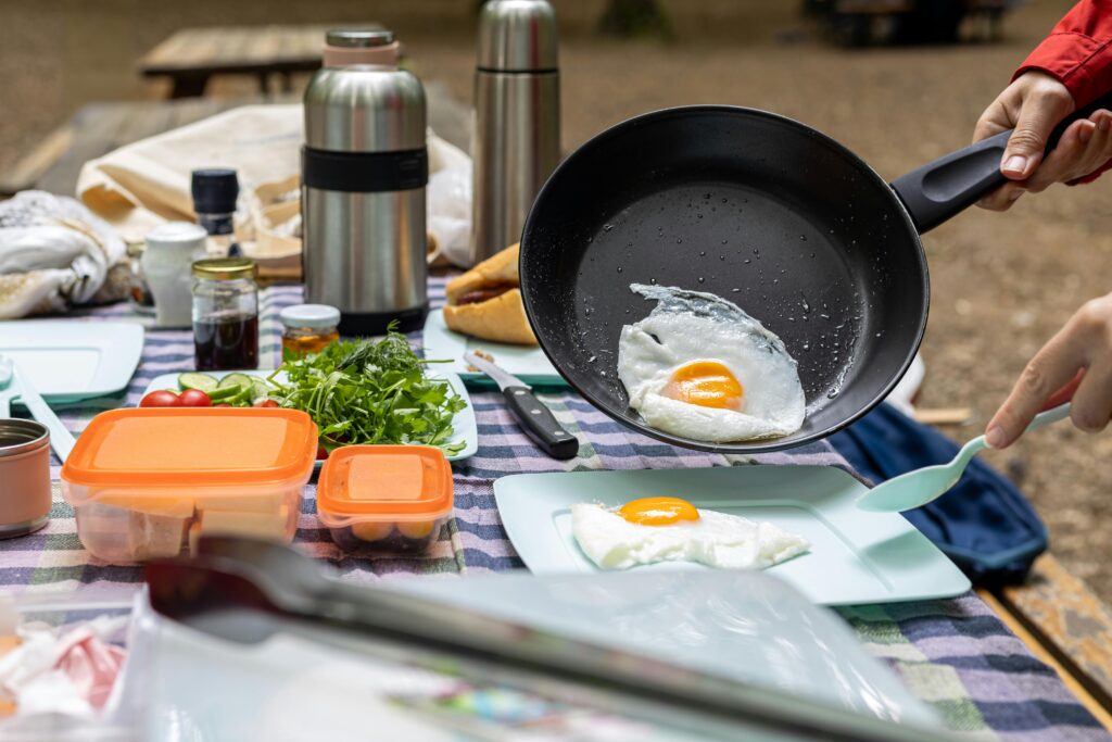 fried eggs cooked on camping gas stoves